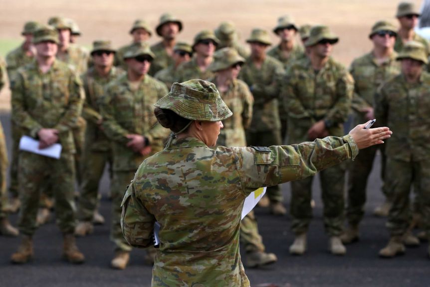ADF officer directing her team