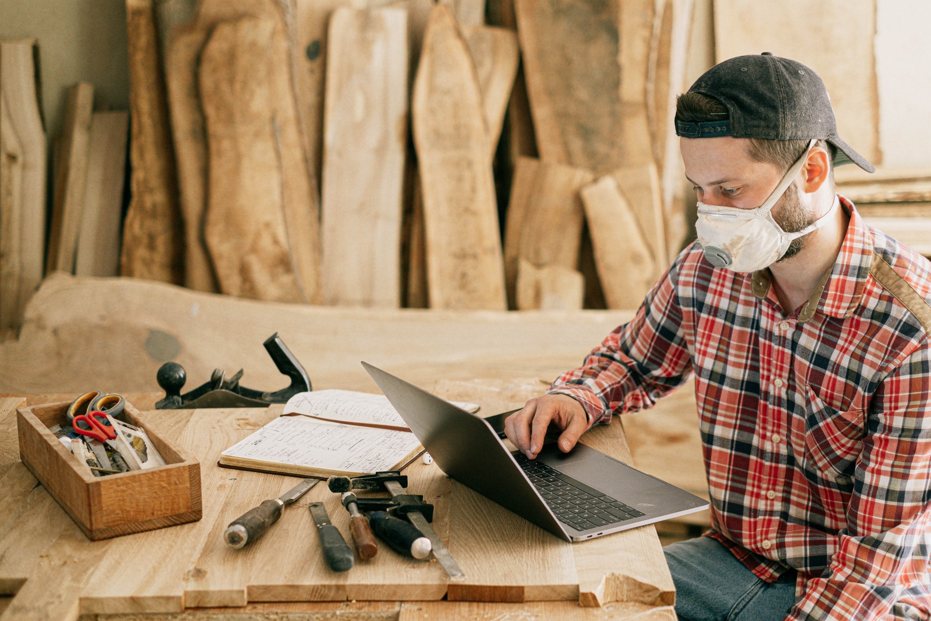 carpenter working at laptop